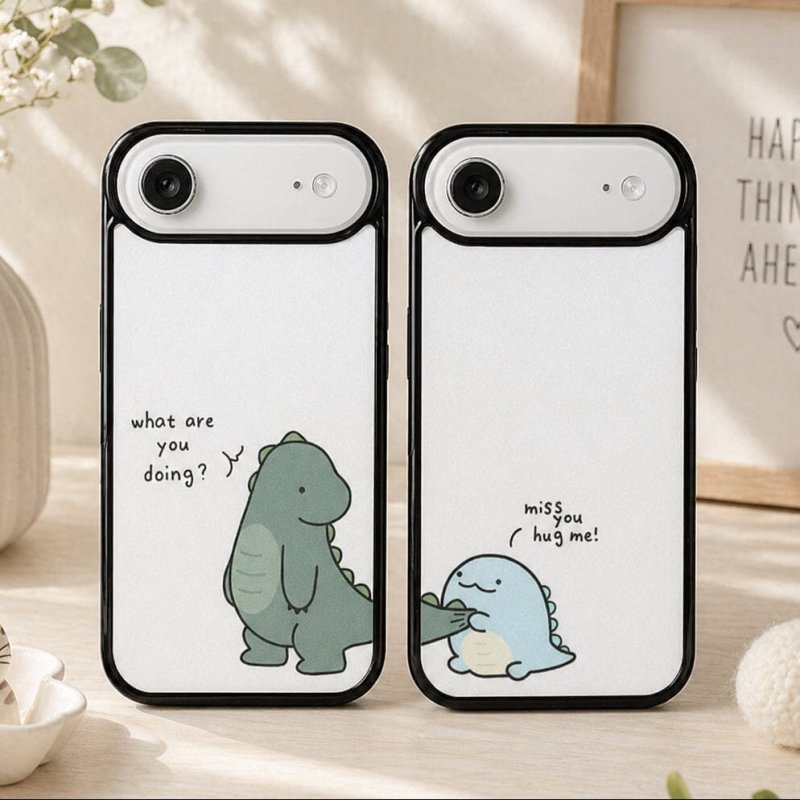 Two phone cases with cartoon dinosaur designs