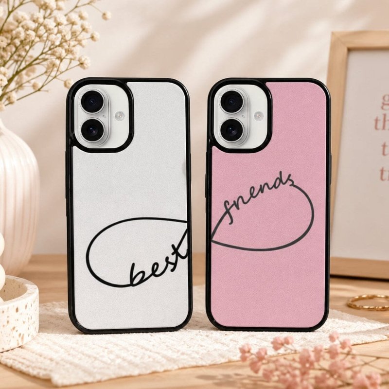 Two phone cases, one white and one pink, with 'best friends' design
